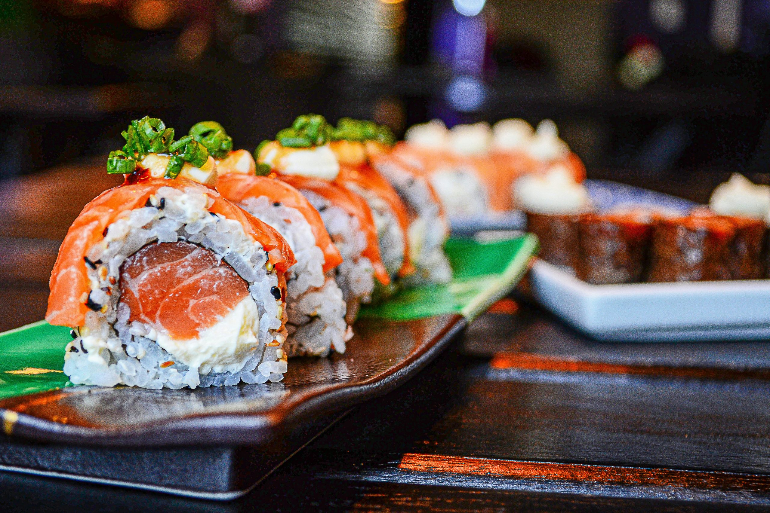 A colorful assortment of sushi rolls and Japanese sushi dishes